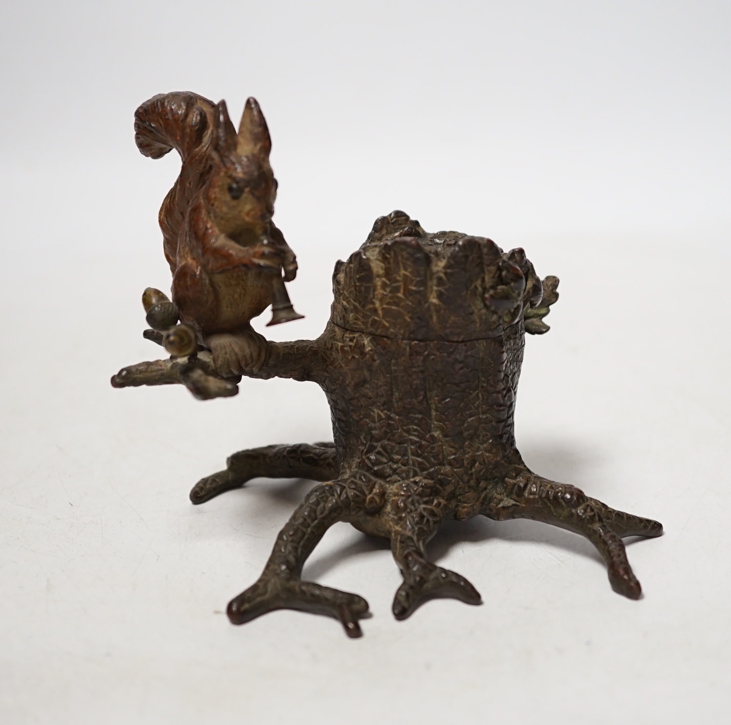 A cold painted bronze inkwell with squirrel, marked ‘Guschutzt’, 10cm